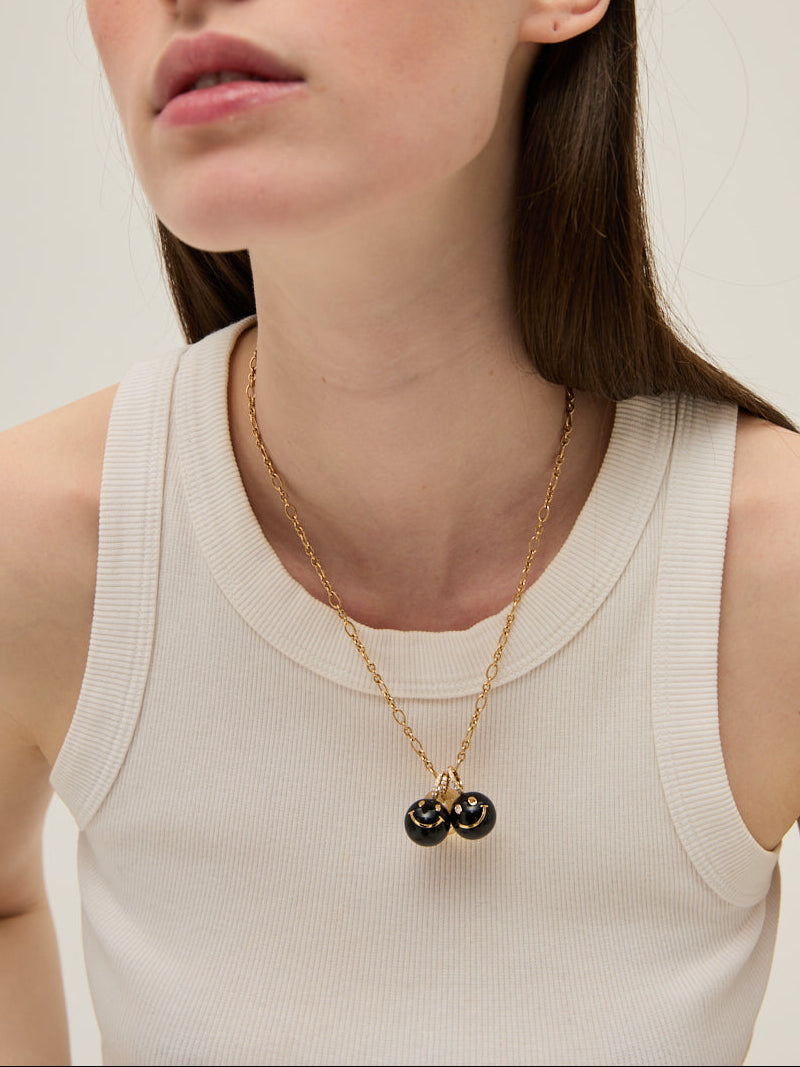 HAPPY FACE ONYX PENDANT
