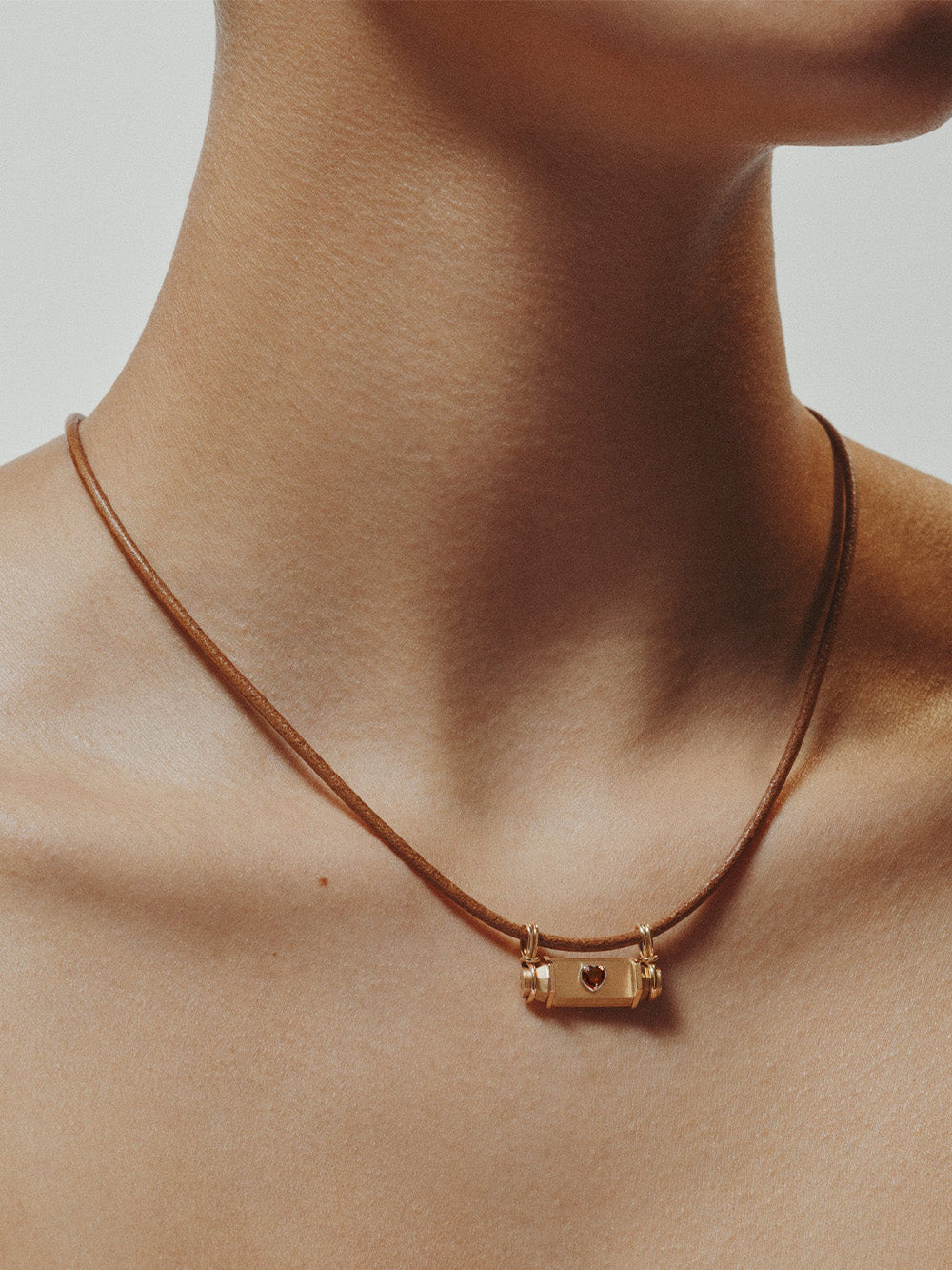 SMASH HEART LEATHER LOCKET OJ18K